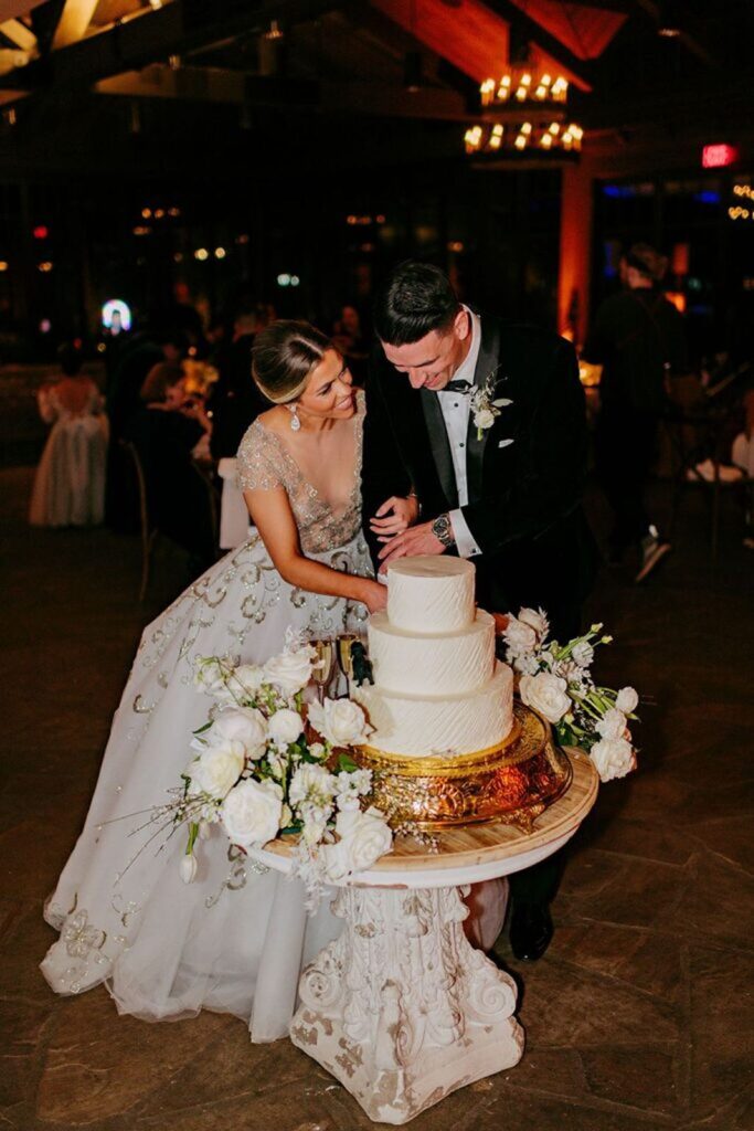 Bride and Groom cutting their wedding cake together