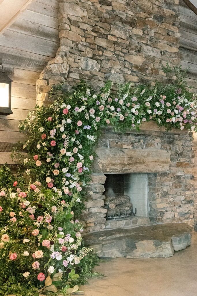 brick fireplace decorated with florals