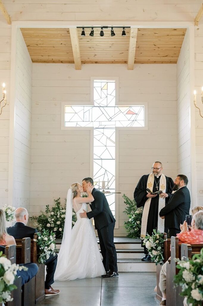 Bride and Groom kissing after wedding ceremony