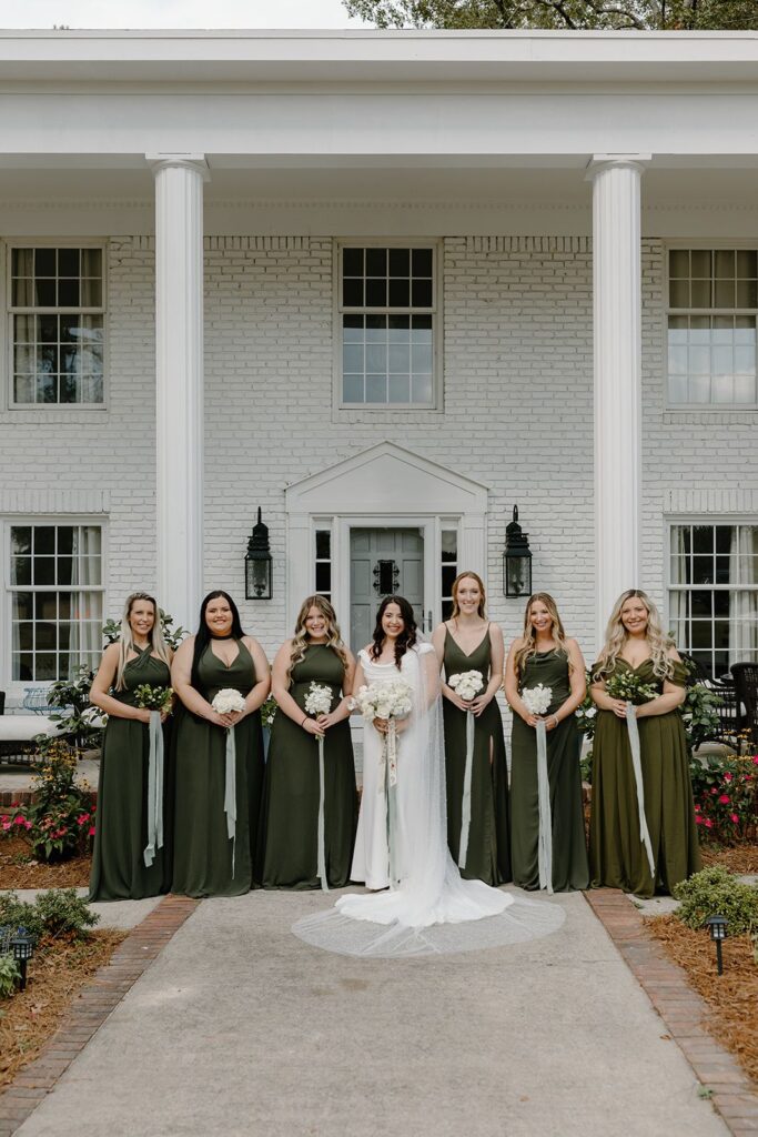 Bridesmaids posed outside wedding venue in Lexington