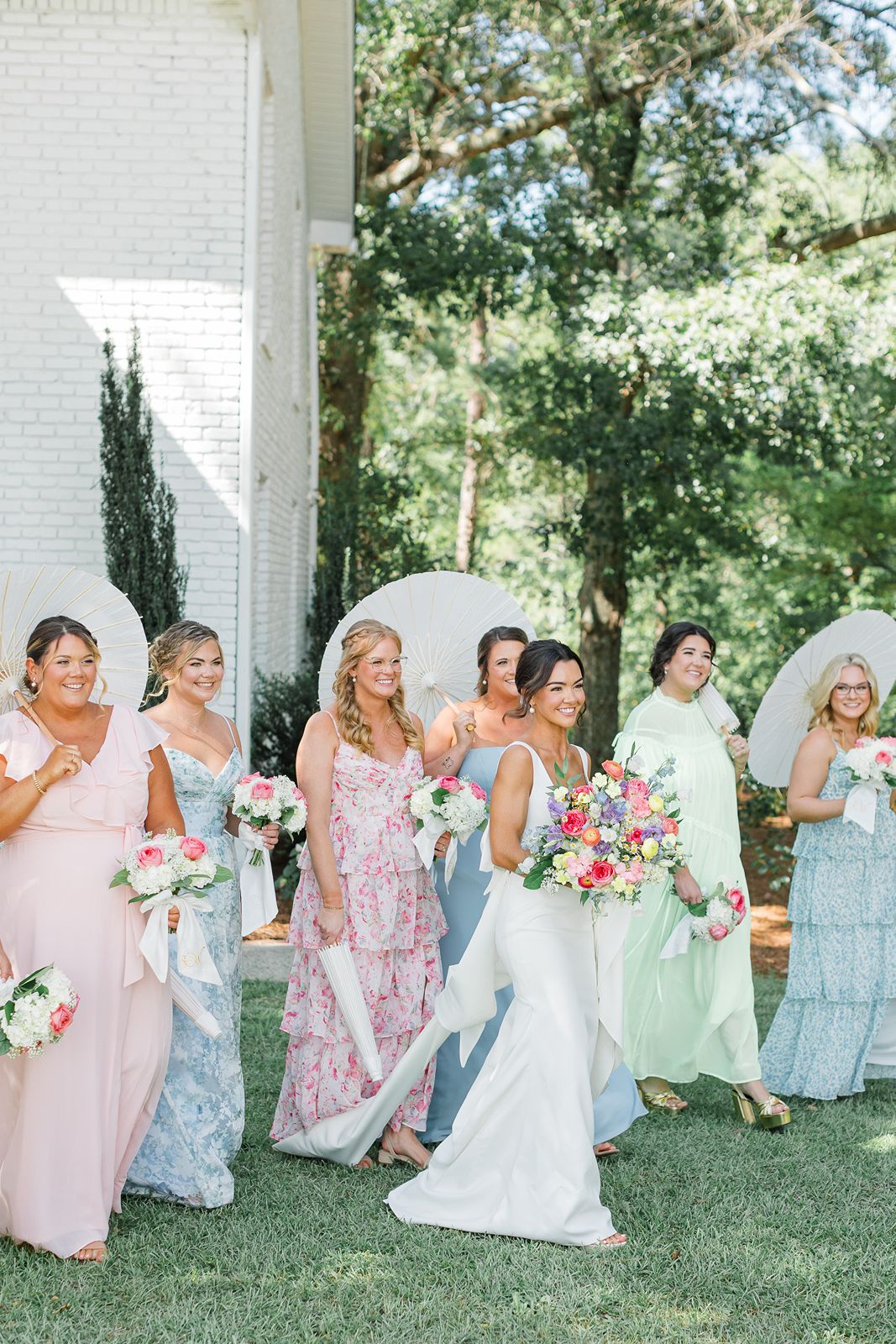 bride and bridesmaids walking at heron hill venue