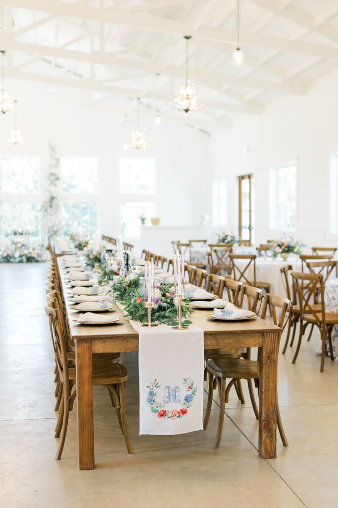 Wedding reception tables decorated with greenery