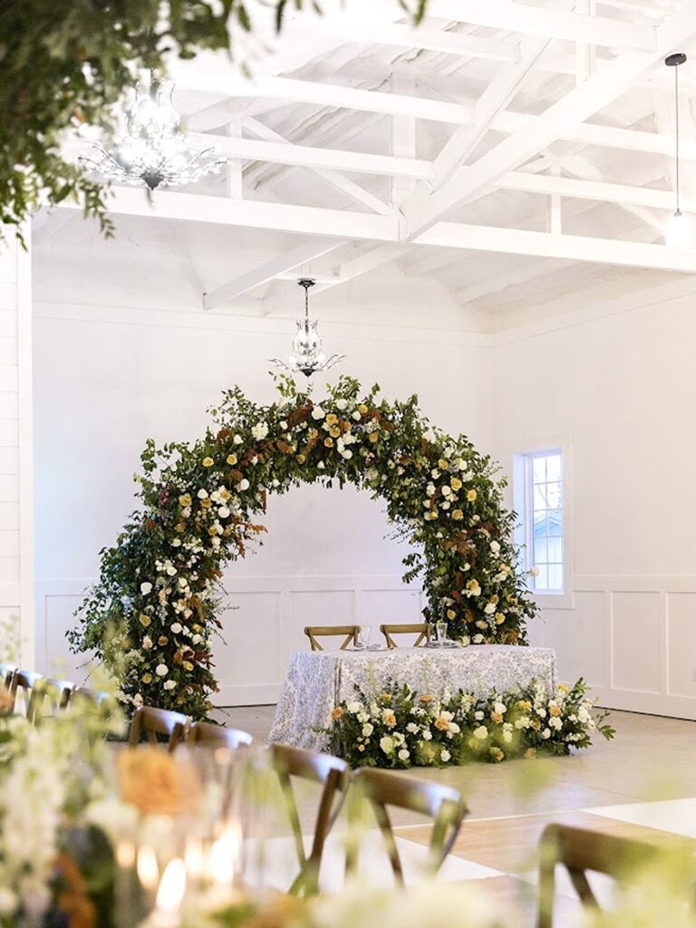 Floral arch in reception space at Heron Hill