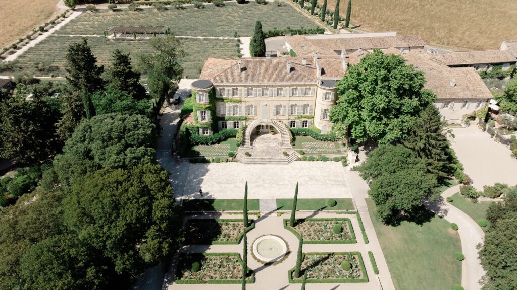 Elegant French château surrounded by manicured gardens and vineyards, the perfect wedding venue in France