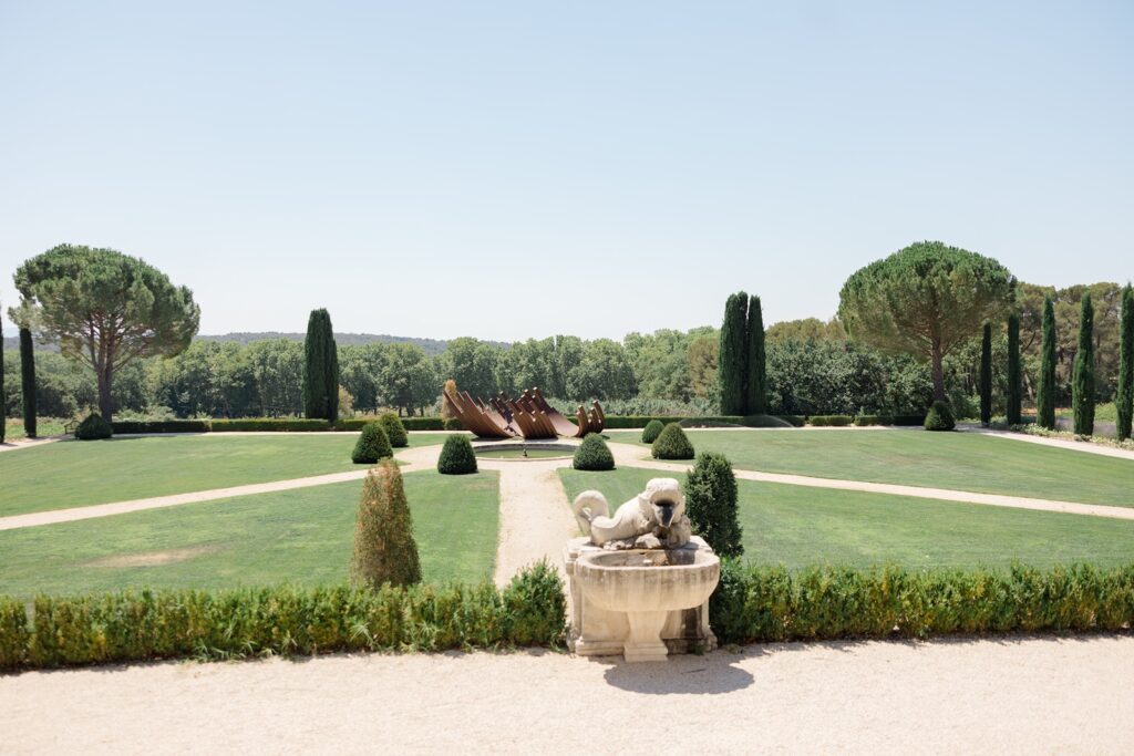 Sweeping lawns, cypress trees, and art beneath the Provençal sky